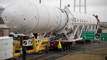 In this photo provided by NASA, a Northrop Grumman Antares rocket arrives at launch Pad-0A, Wednesday, Feb. 5, 2020, at NASA's Wallops Flight Facility in Virginia. Northrop Grumman's 13th contracted cargo resupply mission with NASA to the International Space Station will deliver about 8,000 pounds of science and research, crew supplies and vehicle hardware to the orbital laboratory and its crew. The CRS-13 Cygnus spacecraft is named after the first African-American astronaut, Maj. Robert Henry Lawrence Jr., and is scheduled to launch Sunday, Feb. 9. (Aubrey Gemignani/NASA via AP)