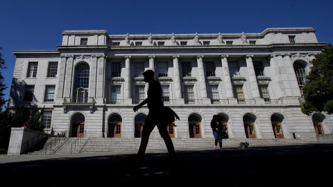 People walk in front of Wheeler Hall on the University of California campus in Berkeley, Calif., Wednesday, March 11, 2020. UC Berkeley has suspended in-person classes due to coronavirus concerns. (AP Photo/Jeff Chiu)