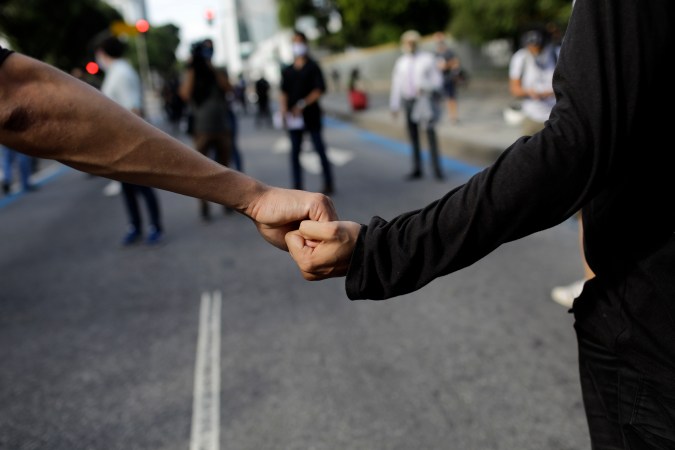 People protest against racism and hate crimes during a Black Lives Matter demonstration in Rio de Janeiro, Brazil, Sunday, June 7, 2020. (AP Photo/Silvia Izquierdo)