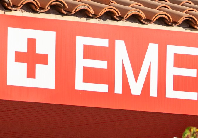 FILE - In this Dec. 18, 2020 file photo an unidentified patient receives oxygen on a stretcher, while Los Angeles Fire Department Paramedics monitor him outside the Emergency entrance, waiting for admission at the CHA Hollywood Presbyterian Medical Center in Los Angeles. California hospitals are facing increasingly difficult decisions about which services to postpone amid a crushing load of coronavirus patients. Intensive-care beds are full in Southern California and the Central Valley, with statewide availability at only 1.1%. (AP Photo/Damian Dovarganes,File)