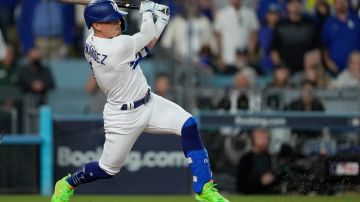 Los Angeles Dodgers' Kiké Hernández drives in a run with an infield single during the sixth inning in Game 2 of a baseball NL Division Series against the Arizona Diamondbacks, Monday, Oct. 9, 2023, in Los Angeles. (AP Photo/Ashley Landis)