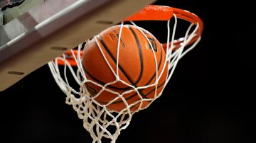 A basketball sits in the net before an NCAA college basketball game between Iowa State and Kansas State, Wednesday, Jan. 24, 2024, in Ames, Iowa. (AP Photo/Charlie Neibergall)