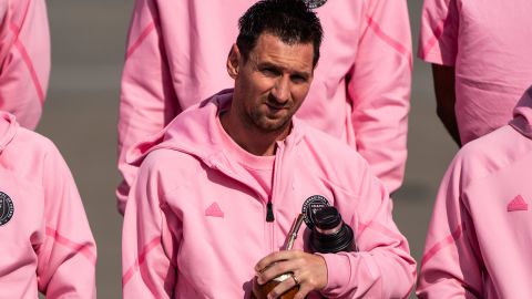 Inter Miami's Argentine forward Lionel Messi, center, poses for photos as he arrives at Hong Kong International airport with US Inter Miami CF team in Hong Kong, Friday, Feb. 2, 2024. (AP Photo/Louise Delmotte)