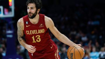 FILE - Cleveland Cavaliers guard Ricky Rubio dribbles during the second half of an NBA basketball game against the Charlotte Hornets in Charlotte, N.C., Sunday, March 12, 2023. Rubio plans to continue his playing career with Barcelona after signing a short-term contract Tuesday, Feb. 6, 2024, a month after he announced that his 12-year NBA career was over. (AP Photo/Nell Redmond, File)