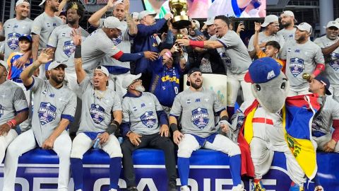 Venezuela players celebrate their 3-0 victory over the Dominican Republic in the championship game of the baseball Caribbean Series, Friday, Feb. 9, 2024, in Miami. (AP Photo/Wilfredo Lee)