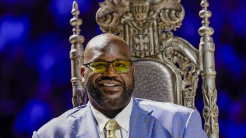 Shaquille O'Neal listens to presenters as his Orlando Magic jersey number is retired, after the Magic's NBA basketball game against the Oklahoma City Thunder, Tuesday, Feb. 13, 2024, in Orlando, Fla. (AP Photo/Kevin Kolczynski)