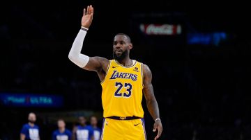 Los Angeles Lakers forward LeBron James gestures during the second half of an NBA basketball game against the Detroit Pistons, Tuesday, Feb. 13, 2024, in Los Angeles. (AP Photo/Ryan Sun)