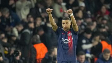 PSG's Kylian Mbappe celebrates after scoring his side's opening goal during the Champions League round of 16 first leg soccer match between Paris Saint-Germain and Real Sociedad, at the Parc des Princes stadium in Paris, France, Wednesday, Feb. 14, 2024. (AP Photo/Christophe Ena)