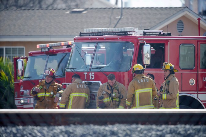 Firefighters respond to the scene of a truck explosion on Thursday, Feb. 15, 2024 in the Wilmington section of Los Angeles. Authorities say a burning truck’s fuel tank exploded on Thursday while Los Angeles firefighters were trying to battle the blaze, injuring seven of them, including two critically. (AP Photo/Eric Thayer)