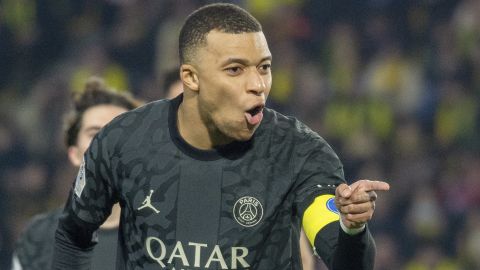 PSG's Kylian Mbappe celebrates after scoring his side's second goal from a penalty shot during the French League One soccer match between Nantes and Paris Saint-Germain at the Stade de la Beaujoire in Nantes, France, Saturday, Feb. 17, 2024. (AP Photo/Mathieu Pattier)