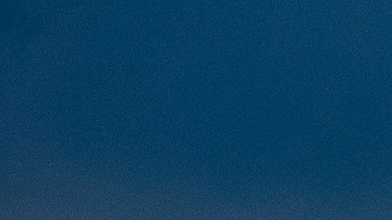 A plane descends into Los Angeles International Airport as low clouds gather over the Pacific ahead of forecasted rain in Los Angeles, Sunday, Feb. 18, 2024. (AP Photo/Damian Dovarganes)