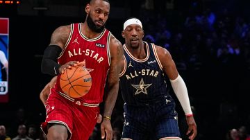 Los Angeles Lakers forward LeBron James (23) drives past Miami Heat center Bam Adebayo during the first half of an NBA All-Star basketball game in Indianapolis, Sunday, Feb. 18, 2024. (AP Photo/Darron Cummings)