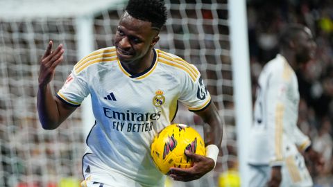 Real Madrid's Vinicius Junior reacts during a Spanish La Liga soccer match between Real Madrid and Sevilla at the Santiago Bernabeu stadium in Madrid, Spain, Sunday, Feb. 25, 2024. (AP Photo/Manu Fernandez)