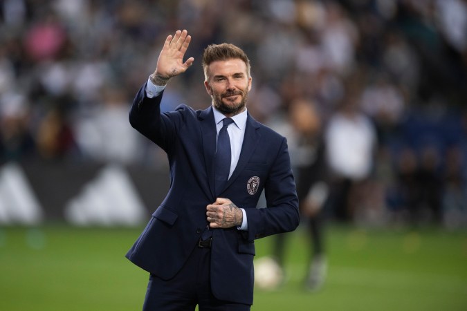 Inter Miami co-owner David Beckham waves toward the stands before an MLS soccer match against the Los Angeles Galaxy, Saturday, Feb. 25, 2024, in Carson, Calif. (AP Photo/Kyusung Gong)
