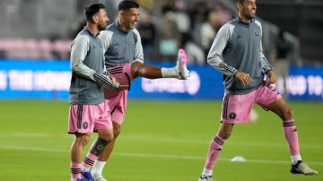 Inter Miami forward Lionel Messi, left, forward Luis Suarez, center, and midfielder Sergio Busquets, right, warm up before an MLS soccer match against Real Salt Lake, Wednesday, Feb. 21, 2024, in Fort Lauderdale, Fla. (AP Photo/Lynne Sladky)