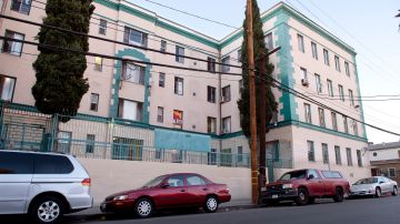 This Tuesday, Jan. 12, 2016m photo shows the apartment building in the Westlake section of Los Angeles where Marvin Velasco says he was abused. In September 2014, the 14-year-old from Guatemala was sent to the tiny apartment of a distant relative whom he had never met, where he was held for three weeks. Marvin says his sponsor deprived him of food, which left him weak and praying for his salvation. (AP Photo/Mark J. Terrill)