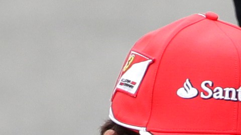 Mercedes Grand Prix driver Michael Schumacher of Germany, right, and Ferrari driver Fernando Alonso of Spain talk during the pilots official photo prior to the Formula One Brazilian Grand Prix at the Interlagos race track in Sao Paulo, Brazil, Sunday, Nov. 25, 2012. (AP Photo/Victor R. Caivano)