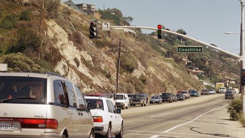 Traffic moves along Pacific Coast Highway in Malibu, Calif., with relative ease, Sept. 2, 1997 photo, but come this winter with the on slaught of El Nino this all might change. With the coastline cliffs on the left and the sea only a few hundred feet to the right, the high water from the storms of El Nino may have the roadway underwater, sections washed out and mudslides across the traffic lanes. (AP Photo/Nick Ut)