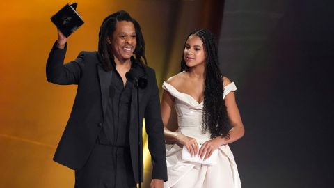 Jay-Z, left, accepts the Dr. Dre Global Impact Award as daughter Blue Ivy Carter, looks on during the 66th annual Grammy Awards on Sunday, Feb. 4, 2024, in Los Angeles.