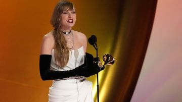 Taylor Swift accepts the award for best pop vocal album for "Midnights" during the 66th annual Grammy Awards on Sunday, Feb. 4, 2024, in Los Angeles.