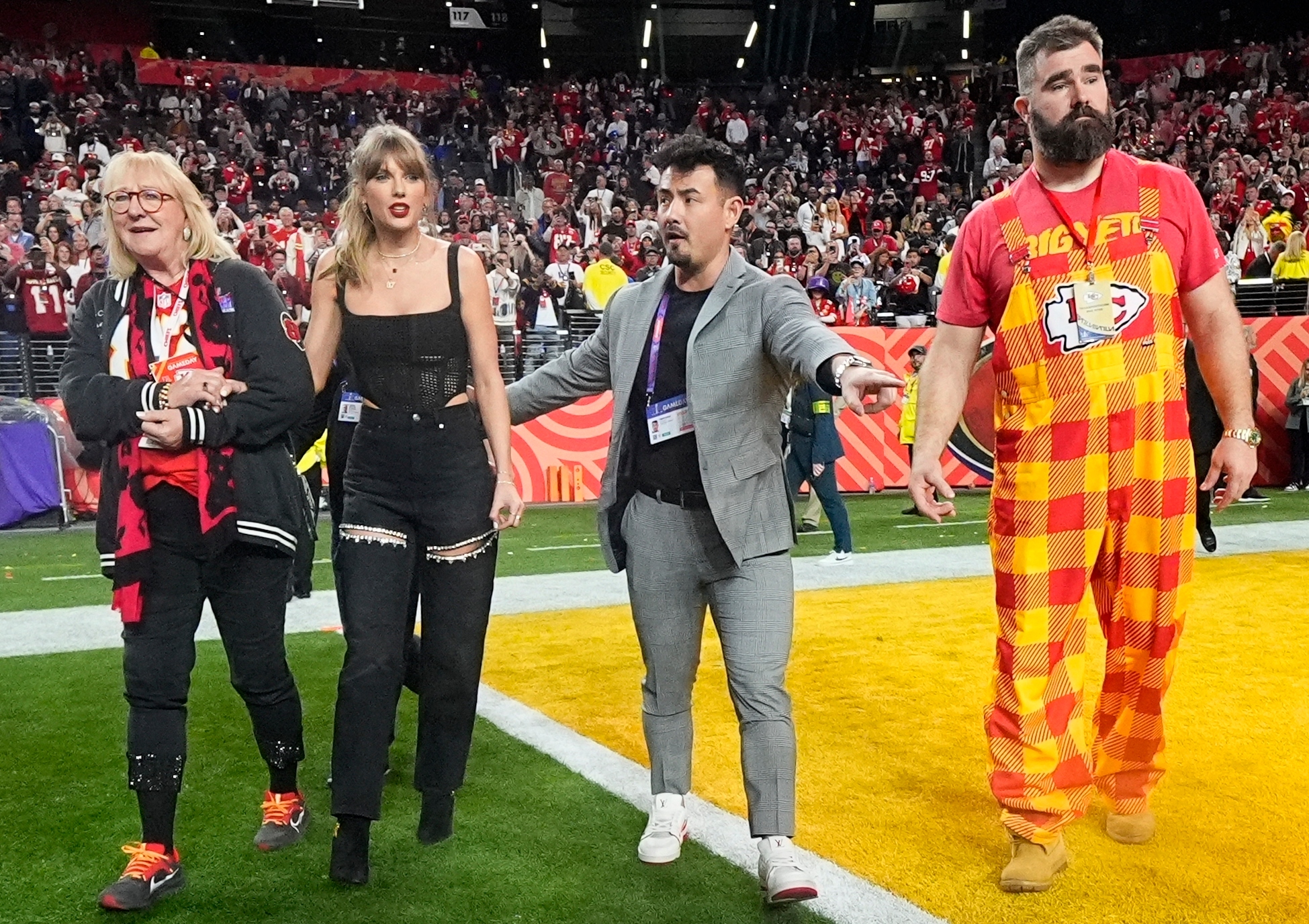 Donna Kelce, left, Taylor Swift, center, and Jason Kelce, right, celebrate after the NFL Super Bowl 58 football game between the Kansas City Chiefs and the San Francisco 49ers on Sunday, Feb. 11, 2024, in Las Vegas. The Chiefs won 25-22 against the 49ers. (AP Photo/Julio Cortez)