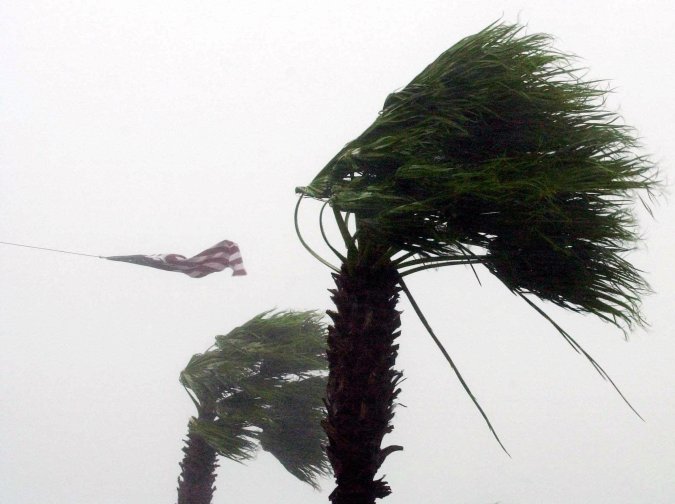 The American flag above the U.S. Coast Guard Auxiliary building in Sarasota, Fla., is nearly torn away by winds from Tropical Storm Gabrielle Friday, Sept. 14, 2001. The storm moved ashore a few miles south of Sarasota. (AP Photo/Chris O'Meara)