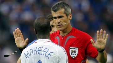 Referee Horacio Elizondo, of Argentina, talks to France Claude Makelele during the final of the soccer World Cup between Italy and France in the Olympic Stadium in Berlin, Sunday, July 9, 2006. (AP Photo/Christophe Ena) ** MOBILE/PDA USAGE OUT **