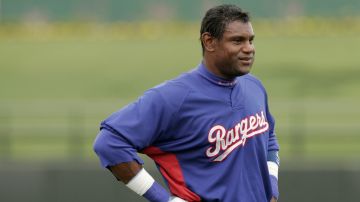 Texas Rangers Sammy Sosa is seen between innings of a spring training baseball game against the Oakland Athletics in Surprise, Ariz., Saturday, March 24, 2007. The Athletics won 5-2. (AP Photo/Tony Gutierrez)
