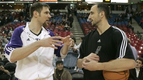 Sacramento Kings forward Andres Nocioni, left, talks with fellow Argentinian Manu Ginobili, of the San Antonio Spurs before the Kings played the Spurs in an NBA basketball game in Sacramento, Calif., Wednesday, Feb. 3, 2010.(AP Photo/Rich Pedroncelli)