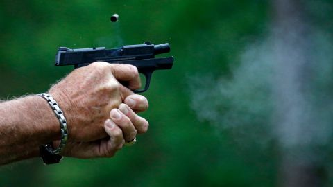 In this April 30, 2016 photograph, gun smoke and a spent round is ejected from a participant's automatic handgun during the live fire portion of a enhanced concealed carry class sponsored by Crestview Baptist Church for members and area residents in Petal, Miss. The 20 participants received hands on assistance during a practical shooting exercise, a thorough review on the fundamentals of safe handling of firearms in addition to a review of the basic and enhanced Mississippi Concealed Carry laws. (AP Photo/Rogelio V. Solis)