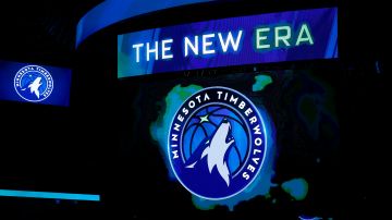 FILE - In this April 11, 2017, file photo, the new Minnesota Timberwolves logo is unveiled on the scoreboard during halftime of the team's NBA basketball game against the Oklahoma City Thunder, in Minneapolis. The Timberwolves are getting into the jersey advertisement game with a Fitbit patch in a three-year deal. The Timberwolves announced the marketing collaboration for the team's first jersey patch on Tuesday, June 20, 2017. (AP Photo/Jim Mone, File)