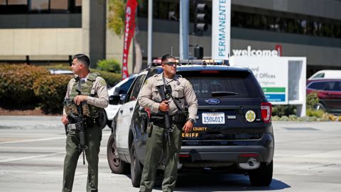 Los Angeles County Sheriff's deputies stand outside after staff and patients were evacuated from Kaiser Permanente Downey Medical Center, following reports of someone with a weapon at the facility in Downey, Calif., Tuesday, Sept. 11, 2018. Los Angeles County sheriff's officials say a suspect is in custody and deputies and police officers are methodically searching the complex. (AP Photo/Jae C. Hong)