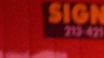 Los Angeles Fire Department paramedics move an injured person into an ambulance after a car crashed against a parked pizza oven trailer on Sunset Boulevard in Los Angeles on Saturday, Dec. 26, 2020. Two people in were transported to a hospital, according to firefighters. (AP Photo/Damian Dovarganes)