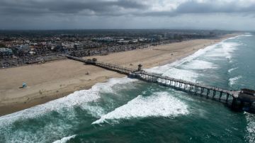 This aerial photo shows a reopened beach in Huntington Beach, Calif., Monday, Oct. 11, 2021. Huntington Beach reopened its shoreline this morning after water testing results came back with non-detectable amounts of oil associated toxins in ocean water, city officials and California State Parks announced. (AP Photo/Ringo H.W. Chiu)