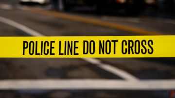 Police tape surrounds the scene of a shooting near the 69th Street Transportation Center in Upper Darby, Pa., Thursday, Dec. 2, 2021. (AP Photo/Matt Rourke)