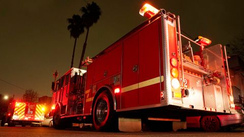 Los Angeles County Fire Department vehicles sit at a medical call Friday, Jan. 7, 2022, in Inglewood, Calif. On occasion, firefighters are transporting patients to the hospital in fire engines due to short staffing at an ambulance company that the fire department contracts with. (AP Photo/Mark J. Terrill)