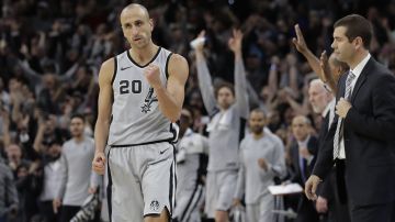 FILE - San Antonio Spurs guard Manu Ginobili (20) pumps his fist after hitting the winning shot in the final seconds of the team's NBA basketball game against the Boston Celtics, Friday, Dec. 8, 2017, in San Antonio. The four-time NBA champion with the San Antonio Spurs is one of the headliners for Saturday night’s enshrinement ceremony in Springfield, Massachusetts. (AP Photo/Eric Gay, File)