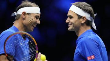 Team Europe's Roger Federer, right, and Rafael Nadal react during their Laver Cup doubles match against Team World's Jack Sock and Frances Tiafoe at the O2 arena in London, Friday, Sept. 23, 2022. (AP Photo/Kin Cheung)