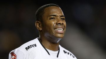 FILE - Atletico Mineiro's Robinho reacts after failing to score during a Copa Libertadores soccer match against Argentina's Racing in Buenos Aires, Argentina, Wednesday, April 27, 2016. The former soccer star was ordered to hand over his passport while Brazilian judicial authorities determine whether he should serve his nine-year sentence for rape in Brazil. Robinho was convicted in Italy in 2017 for his part in a group sexual assault in Milan that took place four years previously, when he was playing for Serie A team AC Milan. He has to deliver his passport to the court within five days, a statement from a Brazilian court said, Friday, March 23, 2023. (AP Photo/Victor R. Caivano, File)