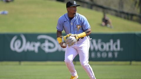 Tampa Bay Rays shortstop Wander Franco looks to second base after catching a fly out during a spring training baseball game against the New York Yankees, Tuesday, Feb. 28, 2023, in Kissimmee, Fla. (AP Photo/Phelan M. Ebenhack)