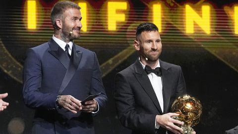 Inter Miami team co-owner and former soccer star David Beckham, left, smiles as Inter Miami's and Argentina's national team player Lionel Messi receives the 2023 Ballon d'Or trophy from during the 67th Ballon d'Or (Golden Ball) award ceremony at Theatre du Chatelet in Paris, France, Monday, Oct. 30, 2023. (AP Photo/Michel Euler)