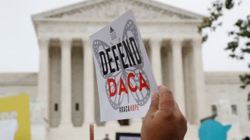 FILE - People rally outside the Supreme Court in support of the Deferred Action for Childhood Arrivals program (DACA), in Washington, Nov. 12, 2019. The U.S. Department of Justice and a civil rights group say they plan to appeal a federal judge’s recent ruling declaring illegal a revised version of a federal policy preventing the deportation of hundreds of thousands of immigrants brought to the U.S. as children. (AP Photo/Jacquelyn Martin, File)