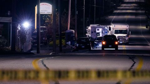 FILE - Police tape cordons off the road to Schemengees Bar and Grille as law enforcement officers maintain their presence in the aftermath of a mass shooting by Army reservist Robert Card in Lewiston, Maine, Oct. 27, 2023. Despite the warning by Card's friend and fellow Army reservist Sean Hodgson, which came alongside a series of other glaring red flags, Army officials discounted the warnings and ultimately did not stop Card from committing Maine's deadliest mass shooting when he killed 18 people in Lewiston. (AP Photo/Matt Rourke, File)