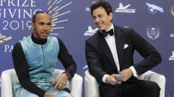 FILE - Formula One Champion Lewis Hamilton of Britain, left, and Mercedes team principal Toto Wolff attend the 2019 FIA Champions' Press Conference in Paris, Friday, Dec. 6, 2019. Lewis Hamilton’s decision to leave Mercedes for Ferrari shocked the Formula One world with even Mercedes team principal Toto Wolff calling it a “surprise.” Wolff said he had heard rumors that Hamilton might leave but didn’t know for sure until the F1 great confirmed it over breakfast on Wednesday, Jan. 31, 2024 at Wolff’s home in Oxford, England. (AP Photo/Michel Euler, File)