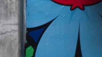 A woman walk under the rain in Los Angeles, Monday, Feb. 19, 2024. (AP Photo/Damian Dovarganes)