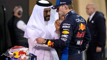 Red Bull driver Max Verstappen of the Netherlands, center, who qualified for pole position, speaks with FIA President Mohammed Ben Sulayem after qualification ahead of the Formula One Bahrain Grand Prix at the Bahrain International Circuit in Sakhir, Bahrain, Friday, March 1, 2024. (AP Photo/Darko Bandic)
