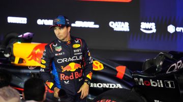 Second place, Red Bull driver Sergio Perez of Mexico stands in the parc ferme during the Formula One Bahrain Grand Prix at the Bahrain International Circuit in Sakhir, Bahrain, Saturday, March 2, 2024. (AP Photo/Darko Bandic)