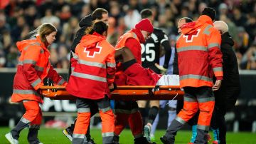 Valencia's Mouctar Diakhaby is stretchered off after getting an injury during the La Liga soccer match between Valencia and Real Madrid at the Mestalla Stadium in Valencia, Spain, Saturday, March 2, 2024. (AP Photo/Jose Breton)