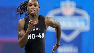 Texas wide receiver Xavier Worthy runs a drill at the NFL football scouting combine, Saturday, March 2, 2024, in Indianapolis. (AP Photo/Michael Conroy)