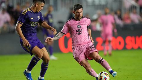 Inter Miami forward Lionel Messi (10) comes under pressure from Orlando City midfielder Cesar Araujo, left, during the second half of an MLS soccer match, Saturday, March 2, 2024, in Fort Lauderdale, Fla. (AP Photo/Rebecca Blackwell)